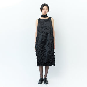 Sleeveless dress with poco poco pattern