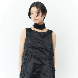 Sleeveless dress with poco poco pattern