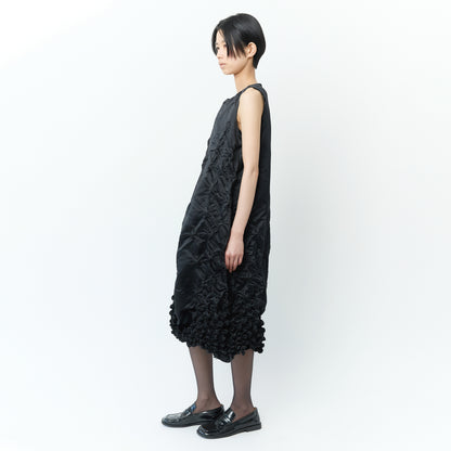 Sleeveless dress with poco poco pattern